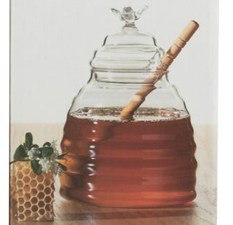 Glass honey pot with wooden dipper