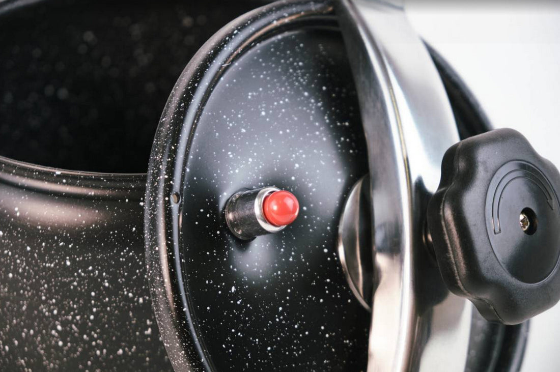 Black 10-litre pressure cooker with non-stick marble coating.